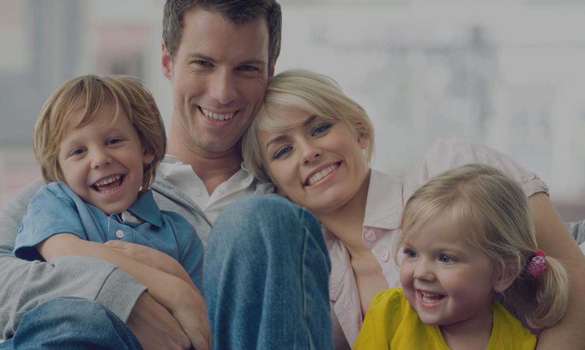 A smiling family — patients of Elite Dental in La Vista, NE